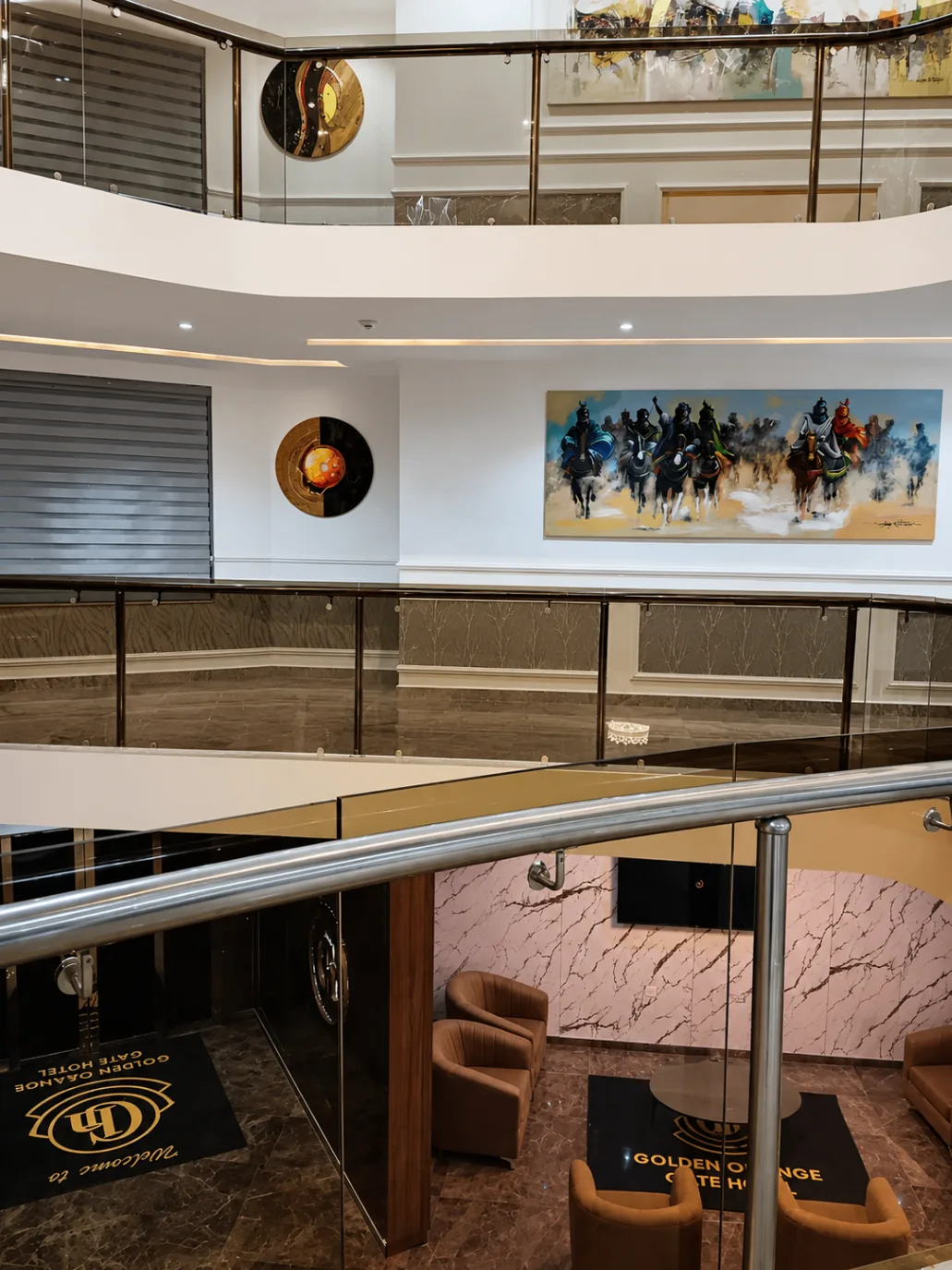 Open atrium view with lounge seating and large horse artwork