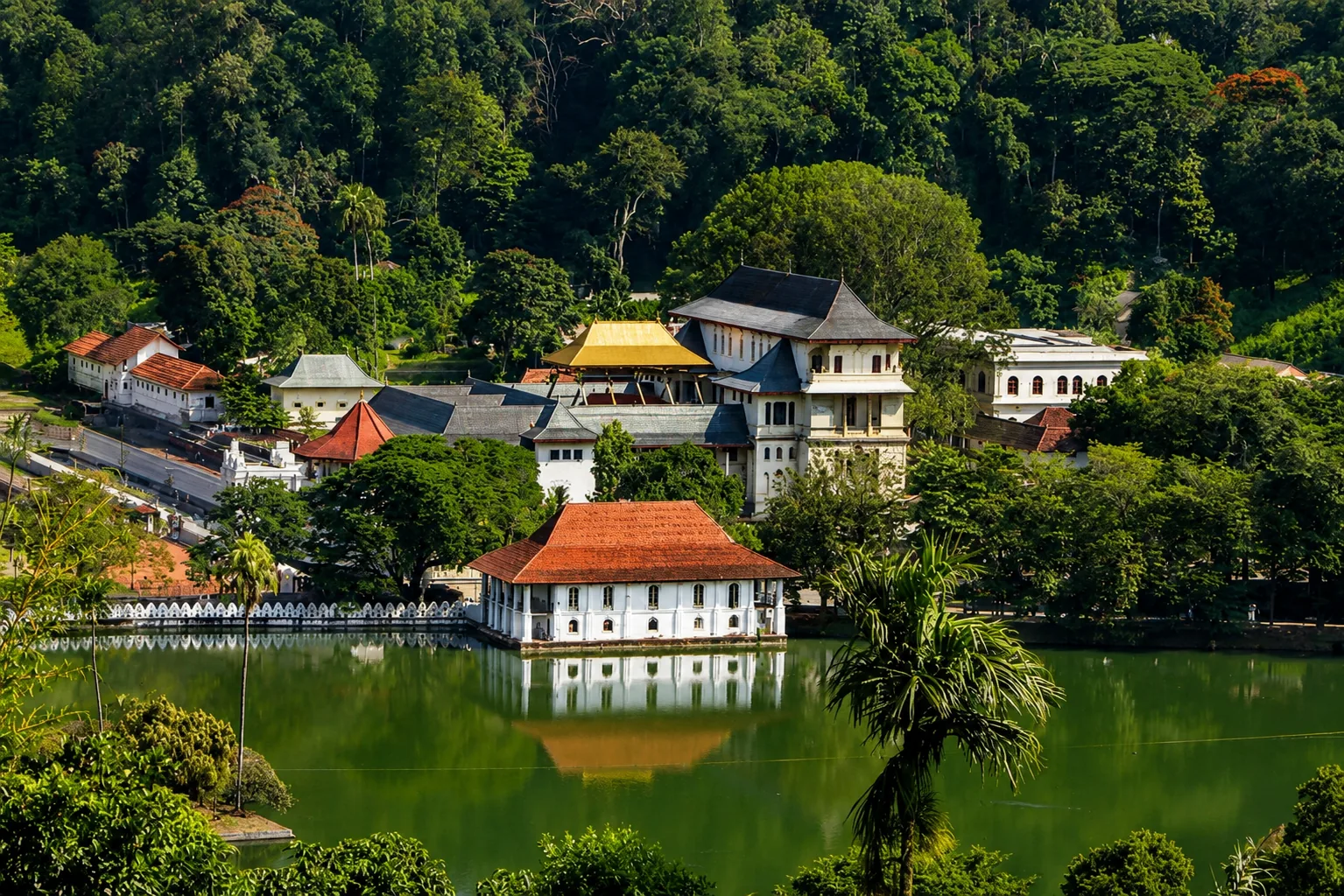 Lakeside palace complex surrounded by greenery in Kaduna
